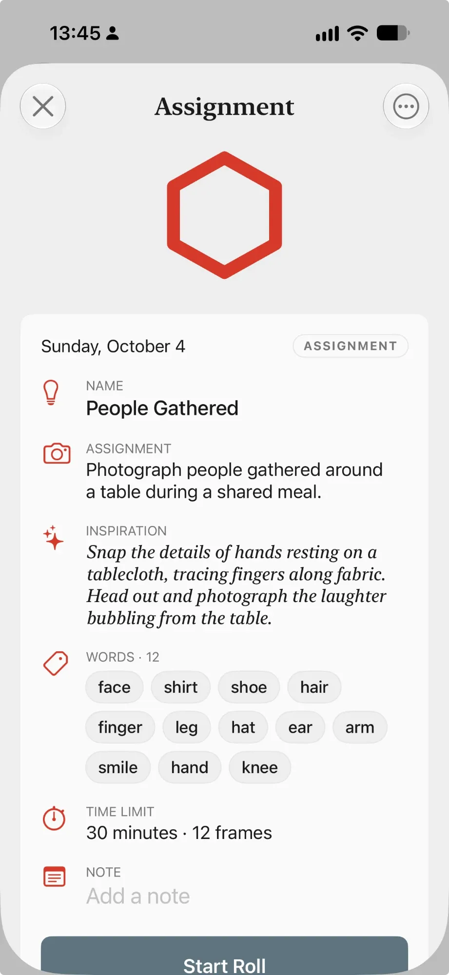 An assignment: Photograph people gathered around a table during a shared meal, with a list of twelve words.